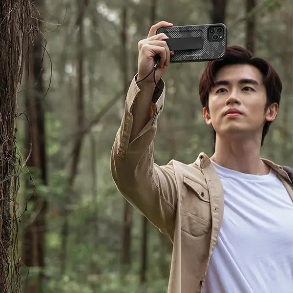 Uniq Heldro case for iPhone 12 Pro Max - black camouflage - Cell phone cases and covers<<<HurtelXML